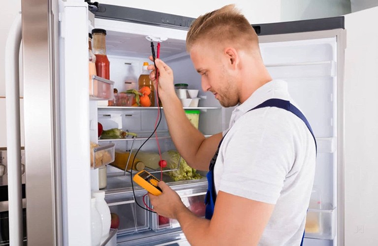 A man doing refrigerator repairs in brisbane