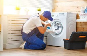 A man doing washing machine repair in brisbane