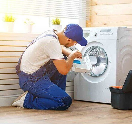A man doing washing machine repair in brisbane