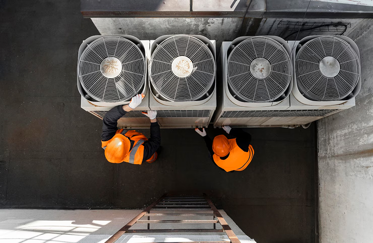 Coolroom repair technician inspecting commercial refrigeration unit